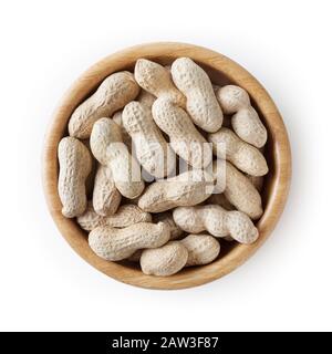 Raw peanuts in wooden bowl isolated on white background with clipping path Stock Photo