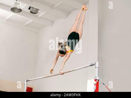 uneven bars woman athlete gymnast in sport gymnastics