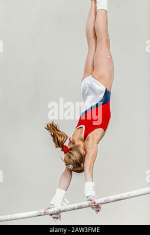 uneven bars woman gymnast exercise in sport gymnastics
