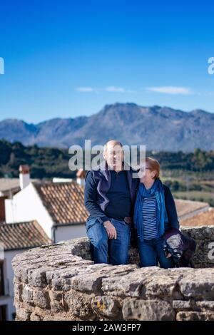 Retired couple resting in nature and enjoying free time Stock Photo