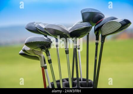 professional golf clubs in bag on green Stock Photo