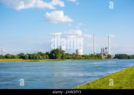 Karlsruhe, Germany - May 31, 2014: Steam power plant and hard coal-fired power station Rheinhafen-Dampfkraftwerk Karlsruhe EnBW, river Rhine in foregr Stock Photo