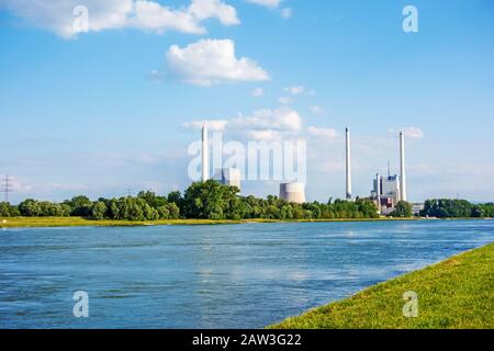 Karlsruhe, Germany - May 31, 2014: Steam power plant and hard coal-fired power station Rheinhafen-Dampfkraftwerk Karlsruhe EnBW, river Rhine in foregr Stock Photo