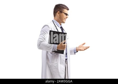 Male doctor in a lab coat standing and gesturing isolated on white background Stock Photo