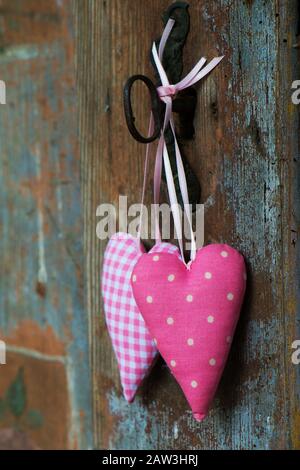 Two hearts on old wooden background Stock Photo