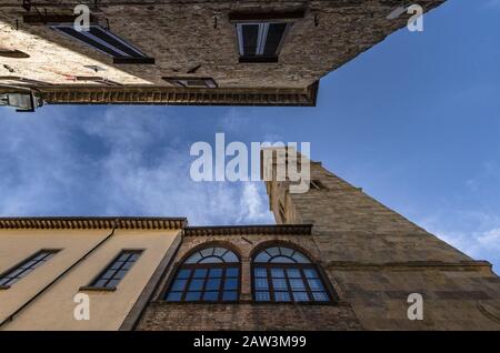 View of the bell tower of Volterra through the streets of the city Stock Photo