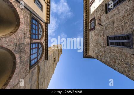 View of the bell tower of Volterra through the streets of the city Stock Photo