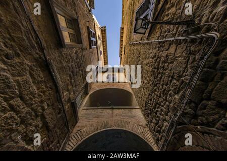 Ancient village with passage under archway in Tuscany Stock Photo