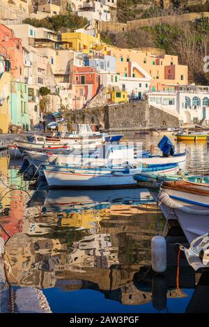 Procida (Italy) - View of Corricella bay in the sunset light, a romantic village of fishermen in Procida, Italy Stock Photo