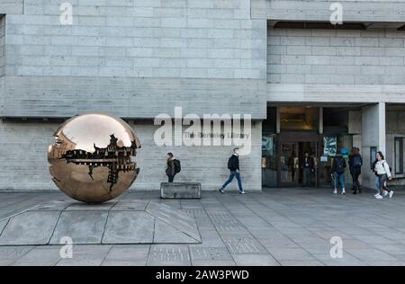 Dublin, Ireland - 29th January 2020:  The golden globe sculpture Sphere at Trinity College, Stock Photo