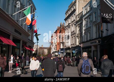 Dublin, Ireland - 29th January 2020: Shoppers and tourists walking on  Grafton Street . Stock Photo