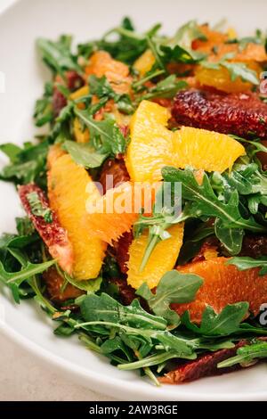 Citrus and arugula salad closeup Stock Photo