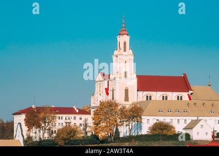 Grodno, Belarus. Catholic Church Of Discovery Of Holy Cross And Bernardine Monastery In Autumn Sunny Day. Stock Photo