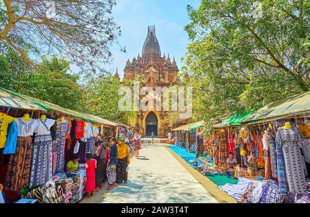 BAGAN, MYANMAR - FEBRUARY 25, 2018:  The market of Htilominlo Temple with small stalls, offering different souvenirs and goods to visitors, on Februar Stock Photo
