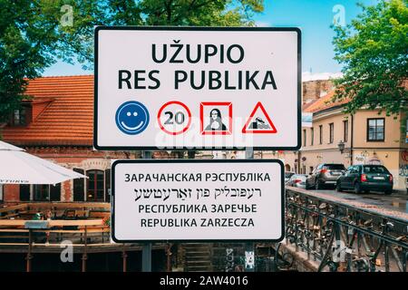 Vilnius, Lithuania - July 5, 2016: Road Sign At Border Of Uzupis Located In Old Town Of Vilnius. District Of Vilniaus Senamiestis. Stock Photo