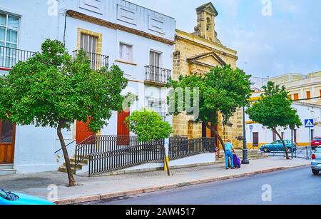 The line of orange trees in front of Our Lady of Anguish Chapel (Capilla de Nuestra Senora de las Angustias), located in Angustias square,  Jerez, Spa Stock Photo
