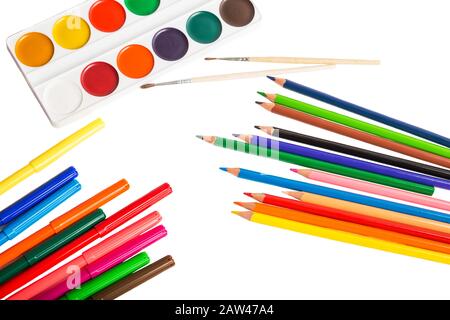 School supplies for drawing - colored pencils, felt-tip pens, watercolor paints and brushes closeup isolated on white background Stock Photo