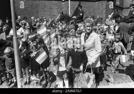 Check the upcoming wedding princess Christina and Jorge Guillermo at City Hall  Audience at the town hall, children with flags Date: June 18, 1975 Location: The Hague, South Holland Keywords: children, princesses, town houses, flags Stock Photo