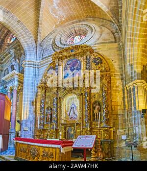 JEREZ, SPAIN - SEPTEMBER 20, 2019: The stunning altarpiece of Immaculate Conception, decorated with carvings, gilt, sculptures, patterns, reliefs and Stock Photo