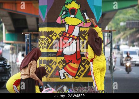 Students seen painting murals at Bandar Lampung flyover, on Thursday, July  18, 2019. 1,500 junior high