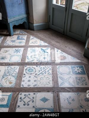 Tile and wood flooring in entrance hall Stock Photo