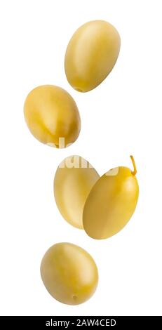 Falling green pickled olives isolated on white background. Stock Photo