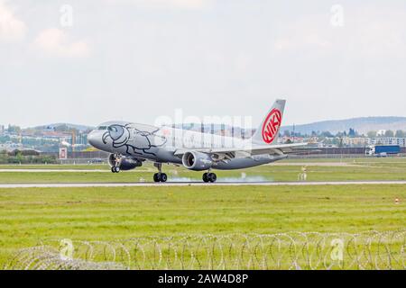Stuttgart, Germany - April 29, 2017: Niki air airplane on touchdown runway - airport Stuttgart Stock Photo
