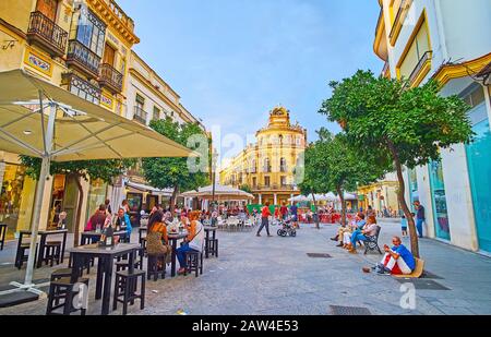 JEREZ, SPAIN - SEPTEMBER 20, 2019: Calle Lanceria street is one of the popular tourist locations with many cafes, stores, bars and landmarks, such as Stock Photo
