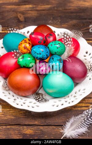 Happy Easter. Painted eggs of different colors on a wooden table Stock Photo