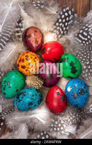 Happy Easter. Painted eggs of different colors on a wooden table Stock Photo