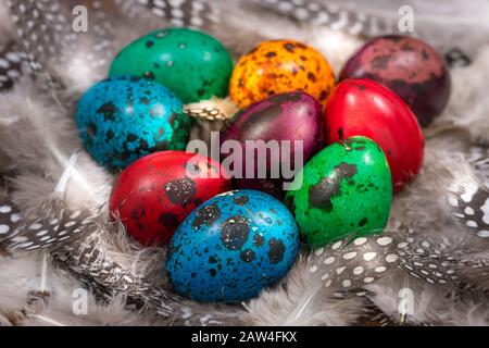 Happy Easter. Painted eggs of different colors on a wooden table Stock Photo
