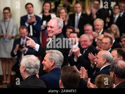 Washington, United States. 06th Feb, 2020. House Minority Whip Steven Scalise, R-LA, stands as President Donald Trump acknowledges him during an event celebrating his acquittal by the Senate in his impeachment trial, at the White House in Washington, DC on February 6, 2020. Trump was acquitted on the two counts against him in his Senate impeachment trial. Photo by Kevin Dietsch/UPI Credit: UPI/Alamy Live News Stock Photo