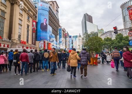SHANGHAI, CHINA - FEBRUARY 14, 2018: People walking on Nanjing Road. The area is the main shopping district of Shanghai and one of the world's busiest Stock Photo