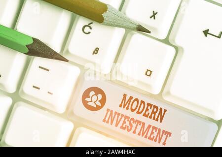 Writing note showing Modern Investment. Business concept for powers the investment concept of diversification Stock Photo