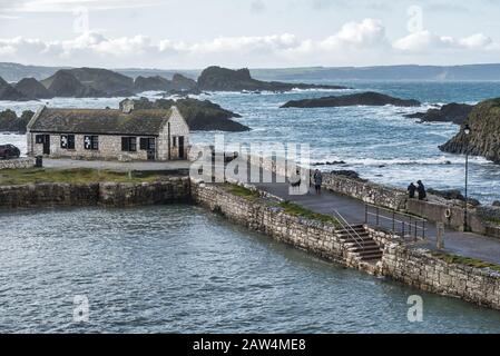 Ballintoy, Northern Ireland - Feb 1, 2020: Ballintoy harbour on the Antrim coast in Northern Ireland.  This was one of the film locations for the Game Stock Photo