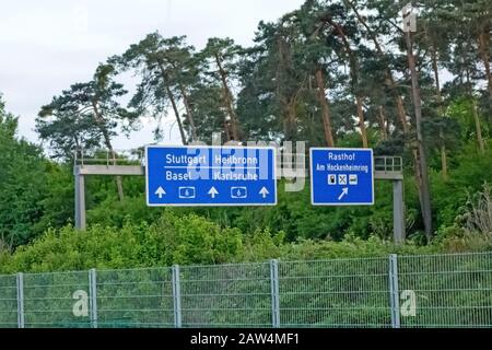 Highway signs at Autobahn A6 showing the way to the racetrack named Hockenheimring Stock Photo