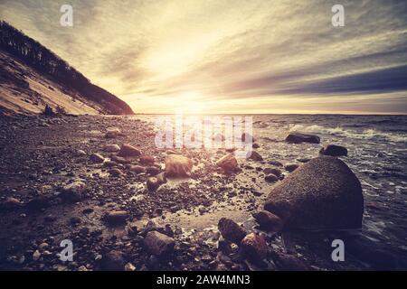 Beach in Wolin National Park at sunset, color toning applied, Poland. Stock Photo