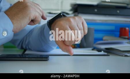 Businessman Image Checking Time and Messages on His Smartwatch Stock Photo
