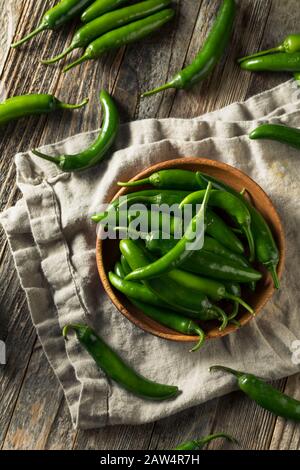 Raw Green Organic Serrano Peppers in  a Bowl Stock Photo
