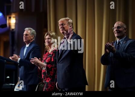 Washington, United States Of America. 06th Feb, 2020. Washington, United States of America. 06 February, 2020. U.S President Donald Trump waves as he arrives at the 2020 National Prayer Breakfast at the Washington Hilton February 6, 2020 in Washington, DC Trump used the normally bipartisan event to savage his opponents calling them vicious and mean following his Senate acquittal in the impeachment trial. Credit: D. Myles Cullen/White House Photo/Alamy Live News
