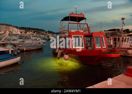 Night fishing red boat in Rovinj harnour, Croatia Stock Photo