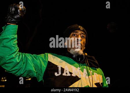 London UK 6th Feb 2020 A man raises a black-gloved fist in the air during demonstration in whithall against an upcoming removal flight expected to transport up to 50 people to Jamaica on 11 February. . Credit: Thabo Jaiyesimi/Alamy Live News