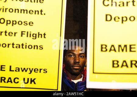 London, UK. 6th Feb, 2020. A Man demonstrates in whithall against an upcoming removal flight expected to transport up to 50 people to Jamaica on 11 February. Credit: Thabo Jaiyesimi/Alamy Live News