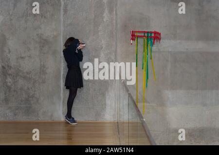 Capital Federal, Buenos Aires / Argentina; Oct 30, 2016: young girl photographing a work of art at the Macba, Museum of Contemporary Art, during Museu Stock Photo