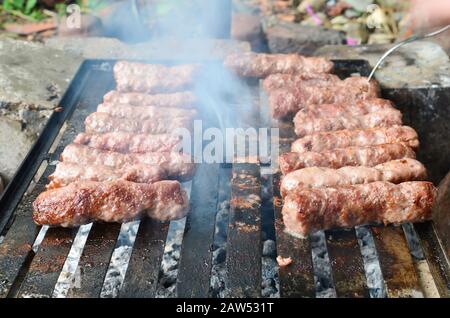 Cevapcici or kebab, traditional barbecue meal in many Balkan countres Stock Photo