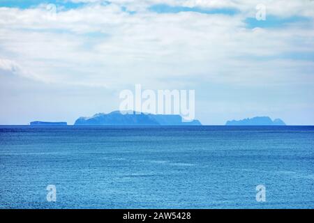 Islands (Ilhas Desertas) in the east of Madeira, from left to right named Chao, Deserta Grande, and Bugio - view from town Canical Stock Photo