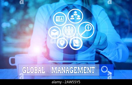 Writing note showing Global Management. Business concept for way an organization analysis its business internationally Stock Photo