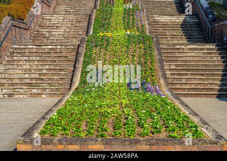 Front stairs of Nagasaki Peace Park in sunny day. A historical park commemorating the atomic bombing of the city on August 9, 1945 during World War II Stock Photo