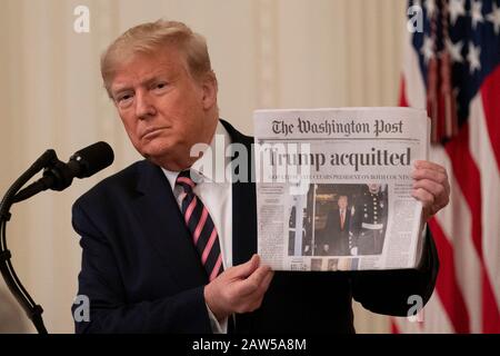 Washington, USA. 6th Feb, 2020. U.S. President Donald Trump holds up a copy of The Washington Post at the White House in Washington, DC, the United States, on Feb. 6, 2020. Donald Trump took a victory lap Thursday, a day after a divided Senate voted to acquit him on impeachment charges. Credit: Liu Jie/Xinhua/Alamy Live News Stock Photo