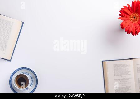 Cup of coffee and books, isolated on white background. Flat lay, top view, copy space. Stock Photo